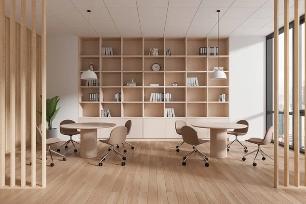 Modern office room interior with minimalist furniture, hardwood floor. Stylish meeting space with table in row, shelf with decoration. Panoramic window on Kuala Lumpur skyscrapers. 3D rendering