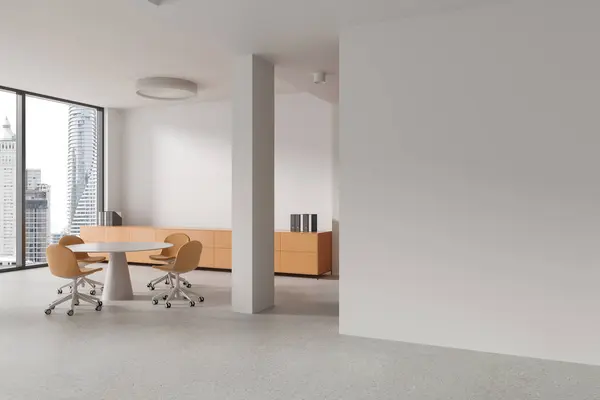 Corner of modern office meeting room with white walls, concrete floor, round conference table with orange chairs and copy space wall on the right. 3d rendering