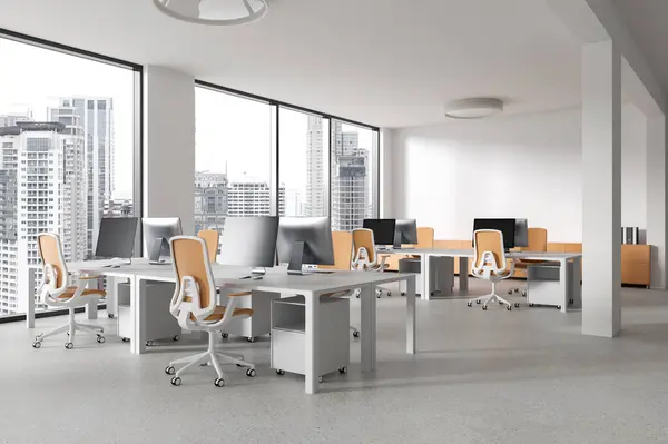 Corner view office loft interior with pc monitors, coworking space with armchairs and desk in row on concrete floor. Stylish workplace with panoramic window on Bangkok skyscrapers. 3D rendering