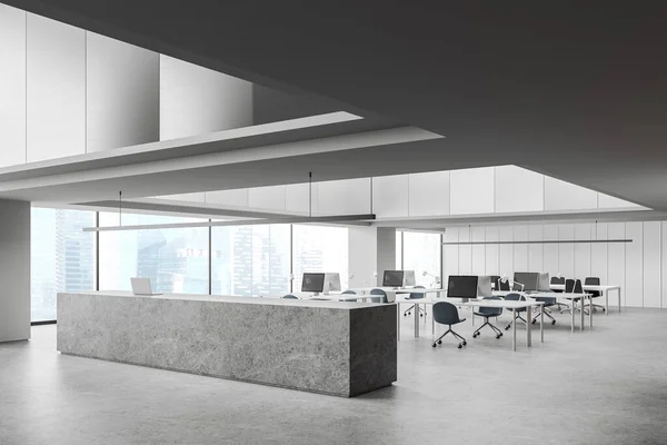 Corner of modern office hall with white and gray walls, concrete floor and long gray reception counter with laptop standing on it. 3d rendering