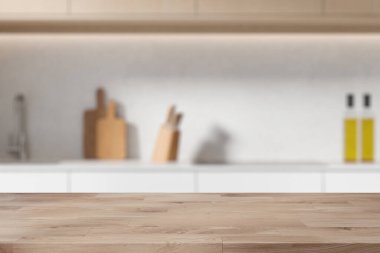 Beyaz duvarları, rahat bej dolapları ve dolapları olan şık, bulanık bir mutfakta bulunan ahşap ürün sergi masası. 3d oluşturma