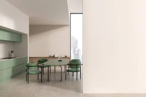 Interior of modern kitchen with white walls, concrete floor, cozy green island with stools and comfortable dining table with black chairs. Copy space wall on the right. 3d rendering