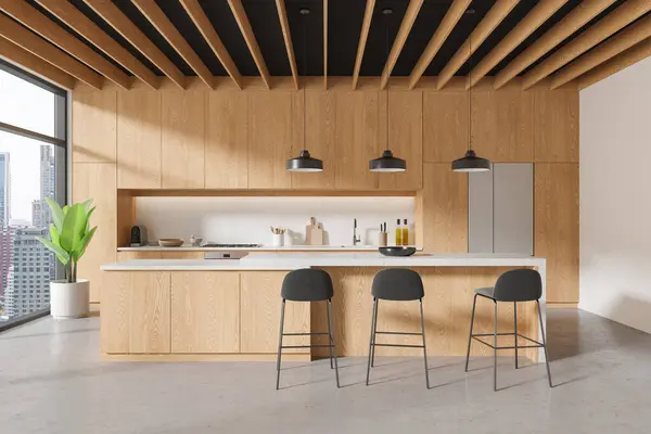 Interior of modern kitchen with wooden walls, concrete floor, wooden cupboards and cabinets and long island with black stools. 3d rendering