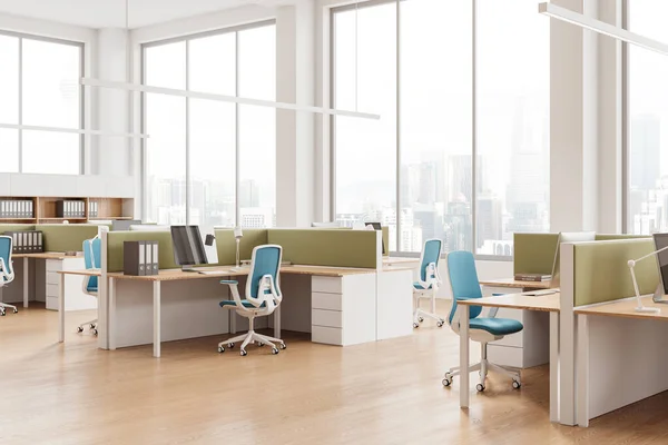 Corner view of coworking interior with pc desktop on table, shelf with documents on hardwood floor. White work zone with panoramic window on Kuala Lumpur skyscrapers. 3D rendering