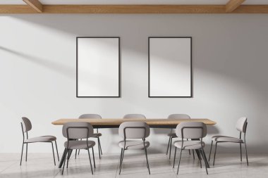 Ahşap masa, sandalyeler ve beton döşemeli şık bir oturma odası. Minimalist mobilyalarla yer kaplamak. Duvarda iki tane tuval posterleri var. 3B görüntüleme