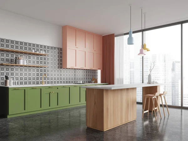 Corner of modern kitchen with white and tiled walls, concrete floor, green cabinets, pink cupboards and cozy wooden island with stools. 3d rendering