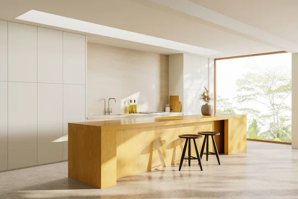 Corner of stylish kitchen with white walls, concrete floor, white cupboards and comfortable wooden island with stools. 3d rendering