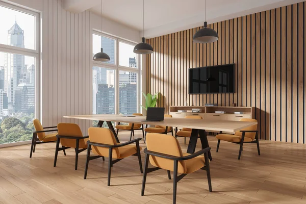Corner of stylish office meeting room with white and wooden walls, wooden floor, long conference table with orange chairs and TV set. 3d rendering