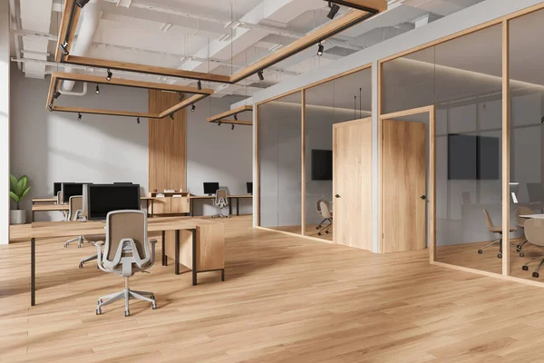 Masada ve koltuklarda bilgisayar olan ofis içi manzarası, tahta ve televizyon ekranlı cam toplantı odası. Mobilya ve teknolojiyle rahat bir çalışma alanı. 3B görüntüleme