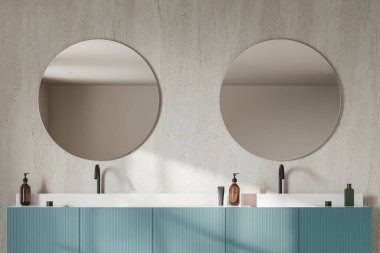 Şık bir otel banyosu, çift lavabo, aksesuarlı mavi süs ve beton duvarlı iki yuvarlak ayna. Modern çağdaş dairede banyo alanı. 3B görüntüleme