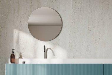 Modern otel banyosu lavabo, aksesuarlı mavi süs ve aydınlık beton duvarlı yuvarlak ayna. Lüks dairede banyo alanı. 3B görüntüleme
