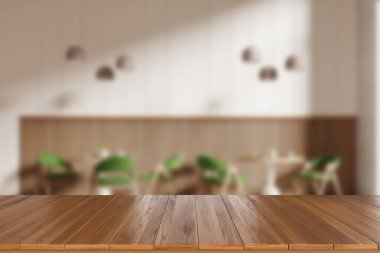 Boş ahşap masa ve kafenin içi bulanık arka planı yeşil sandalyeler ve lambalı masalar. Ürün gösterimi için kopyalama alanı oluşturun. 3B görüntüleme