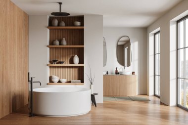 Modern banyo, bej duvarlar, ahşap zemin, rahat yuvarlak küvet ve iki oval aynalı çift lavabo. 3d oluşturma
