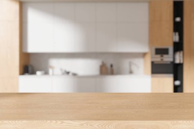 Kaliteli ev mutfağının bulanık arka planında boş ahşap masa. Dolap ve mutfak gereçleri ile yemek pişirme alanı. Ürün gösterimi için kopyalama alanı oluşturun. 3B görüntüleme