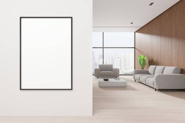 Modern oturma odasının içinde beyaz ve ahşap duvarlar, ahşap zemin, rahat gri koltuk ve sehpanın yanında duran kanepe ve solda afiş süsleri. 3d oluşturma