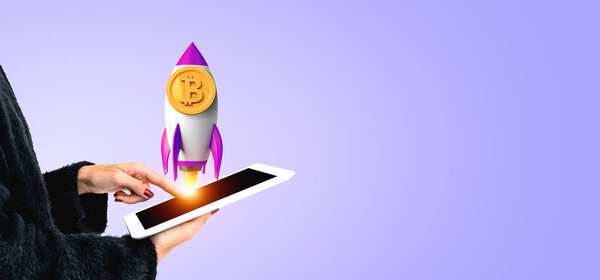 Woman finger touch tablet screen, rocket with bitcoin symbol on copy space empty purple background. Concept of cryptocurrency, business growth and investment