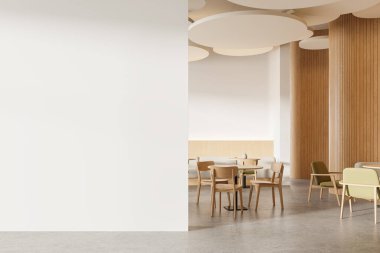 Beyaz ve ahşap duvarları, beton zemini, sandalyeli yuvarlak masaları ve rahat gri koltukları olan modern bir restoran. Soldaki uzay duvarını kopyala. 3d oluşturma