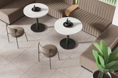 Modern kafe manzarası, sandalyeler ve yuvarlak masa, bej kiremit döşemeli kanepe. Minimalist mobilyaları olan şık bir yemek odası. 3B görüntüleme