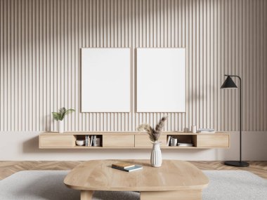 Minimalist oturma odasının içinde bej duvarlar, ahşap zemin ve çekmeceleri ve kitapları olan rahat ahşap bir şifonyer. İki dikey maket poster. 3d oluşturma