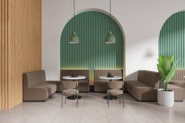 Yeşil ve beyaz kafeteryaların içinde sandalyeler ve tabaklı yuvarlak masa, kiremit zeminde sıralanmış kanepe. Bitkili minimalist kafe yeme alanı. 3B görüntüleme