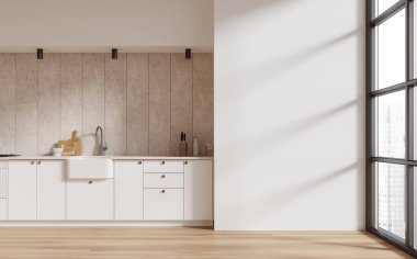 Bej renkli ev mutfağı, şık tasarımı, gökdelenlerin panoramik penceresi. Modern dairede lavabosu ve ocağı olan şık bir yemek alanı. Model boş duvar. 3B görüntüleme