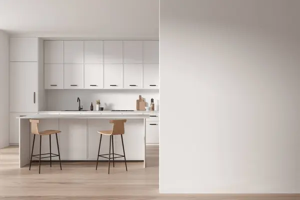 Interior of modern kitchen with white walls, wooden floor, cozy white cupboards and cabinets and comfortable white island with stools. Copy space wall on the right. 3d rendering.