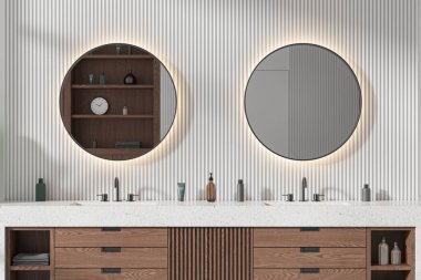 Modern otel banyosu çift lavabolu, ahşap süslemeli, aksesuarlı ve iki yuvarlak aynalı. Modern çağdaş dairede banyo alanı. 3B görüntüleme