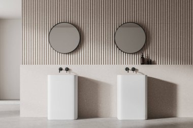 Modern banyo içi iki lavabo, yuvarlak aynalar ve minimalist bej arka planda duvar dokusu. 3B Hazırlama