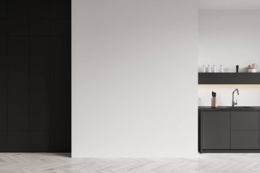 Lüks siyah-beyaz mutfak, lavabo ve mutfak gereçleri tezgahta. Modern dairede, ahşap zeminde minimalist pişirme alanı. Boşluk duvarını kopyala. 3B görüntüleme