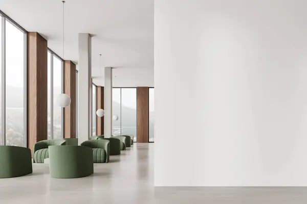 Modern office lobby interior with green armchairs, meeting or consulting space with coffee table and columns. Panoramic window on countryside. Mock up empty wall partition. 3D rendering