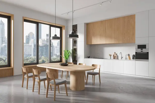 一个现代化的厨房内部 有木制餐桌 椅子和城市景观通过大窗户 轻背景 家庭设计的概念 3D渲染 免版税图库照片