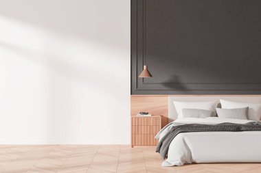 Modern yatak odasının içinde bir yatak odası, komodinli masa ve beyaz ve ahşap tonlarda ışığın aktığı karanlık bir duvara dayanan kolye ışığı. 3B Hazırlama