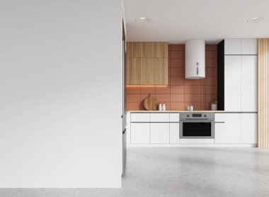 Yemek dolabı, buzdolabı ve kaputu açık beton kaplı fırını olan şık bir ev mutfağı. Modern dairede yemek pişirme yeri. Boş duvar bölmesini düzenle. 3B görüntüleme