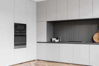 Gri ev mutfağının köşesi. Dolap ve fırın döşeli, ahşap zemin. Ahşap zemini olan şık bir dairede yemek pişirme köşesi. 3B görüntüleme