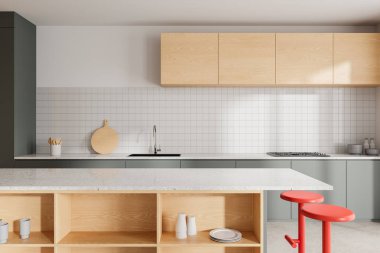 Minimalist ev mutfağı, bar adası ve kırmızı taburesi, bulaşıklı raflar ve lavabo ve sobalı yemek dolabı. Yemek odası ve mutfak gereçleri çok şık. 3B görüntüleme