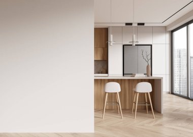 Ahşap dolapları ve bar tabureleri olan modern minimalist mutfak, sol tarafında boş duvar, parlak doğal ışık. Model konsepti. 3B Hazırlama