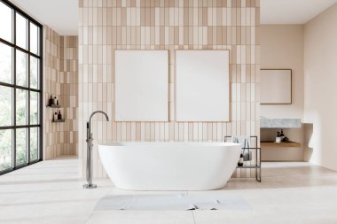 Bej rengi otel banyosu, banyo küveti ve karıştırıcı döşemesi, raflı yan masa ve banyo aksesuarlarıyla lavabo. Fayans duvarında iki tane tuval posterleri var. 3B görüntüleme