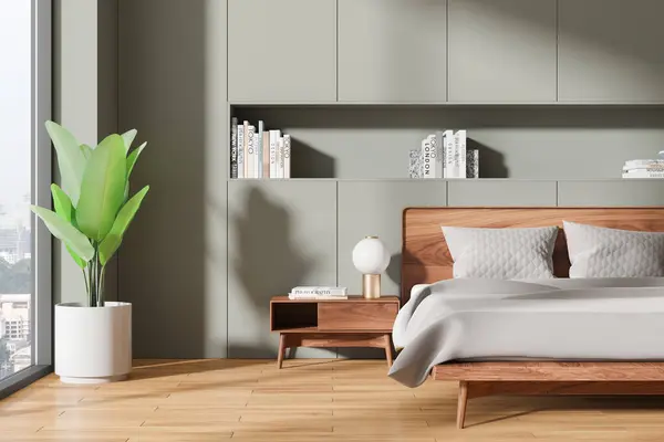 stock image Cozy home bedroom interior with bed, nightstand with decoration and plant on hardwood floor. Sleep room with panoramic window on Singapore skyscrapers. 3D rendering