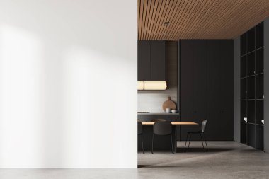 Ev mutfağı, yemek masası, sandalyeler, mutfak malzemeleri ve beton zemin. Mutfak gereçleriyle birlikte siyah yemek dolabı. Boş duvar bölmesini düzenle. 3B görüntüleme