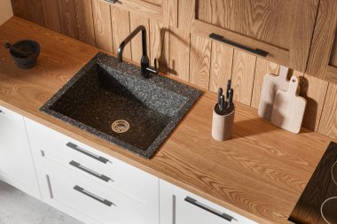 Mutfak lavabosu granit lavabo, ahşap tezgah ve dolaplarla dolu. Hafif ahşap dizayn. Modern mutfak konsepti. 3B görüntüleme
