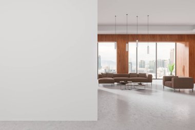 Kahverengi mobilyaları, şehir manzarasına bakan geniş pencereleri ve minimalist tasarımı olan geniş modern oturma odası. Parlak bir atmosfer. İç konsept. 3B görüntüleme