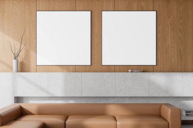 Lüks oturma odasının içinde deri kanepe, dinlenme ya da taş raf, kitap ve lamba ile toplantı alanı var. İki kopya uzay posteri sıraya dizildi. 3B görüntüleme