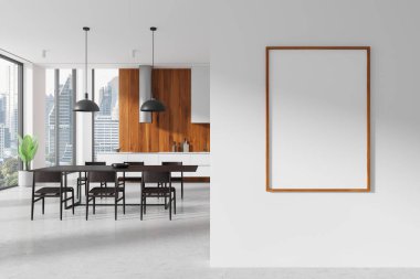 Modern bir mutfakta beyaz bir duvara asılmış çerçeveli boş poster modeli. Ahşap aksanlı, siyah mobilyalı ve büyük pencereli. Şablon kavramı. 3B Hazırlama.