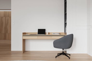 Ahşap bir masa, gri bir sandalye ve beyaz arka planda dizüstü bilgisayarı olan modern minimalist bir ofis. Çalışma alanı tasarımı kavramı. 3B Hazırlama.