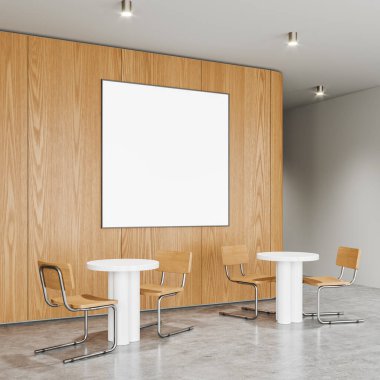 Kafenin içi yuvarlak yemek masaları ve sandalyelerle aydınlık beton zemin. Şık restoran yeme alanı. Ahşap duvarda geniş kare bir tuval var. 3B görüntüleme