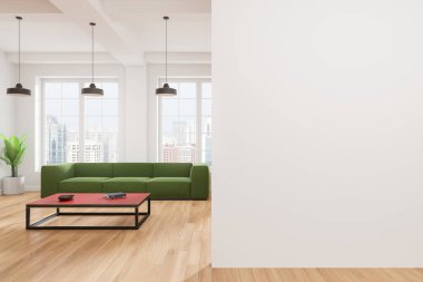 Oturma odasında yeşil bir kanepe, kırmızı bir sehpa ve üç kolye ışığı var. Geniş pencereleri ve ahşap döşemeleri olan parlak bir iç mekan. Model için boş duvar. 3B Hazırlama