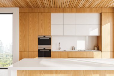 Ahşap dolapları, beyaz tezgahı, dahili aletleri ve şehir manzarasına bakan geniş bir penceresi olan modern bir mutfak. Çağdaş ev tasarımı kavramı. 3B Hazırlama.