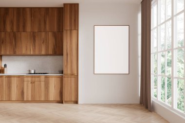 Modern mutfağın içinde ahşap dolaplarla dolu beyaz bir duvara asılmış boş bir poster modeli. Güneş ışığı perdeleri olan büyük bir pencereden akar. 3B Hazırlama