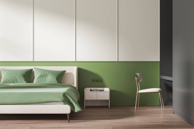 Modern yatak odasının içinde yeşil bir duvar, uyumlu yeşil bir yatak odası, açık bej bir yatak, beyaz bir komodin ve ahşap bir zeminde ahşap bir sandalye var. 3B Hazırlama