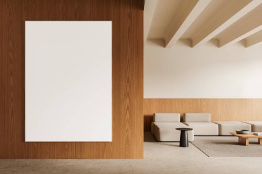 Tarafsız renkli mobilyalar ve minimalist tasarım ile modern bir iç mekanda ahşap bir duvarda asılı boş dikey poster modeli. 3B Hazırlama